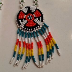 Native American seed bead necklace colorful thunderbird design fringe detail